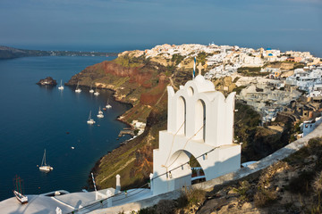 Caldera coastline with Oia village cityscape at Santorini island, Greece