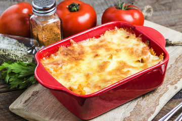 Bacon lovers' mac and cheese in baking dish Cheese face