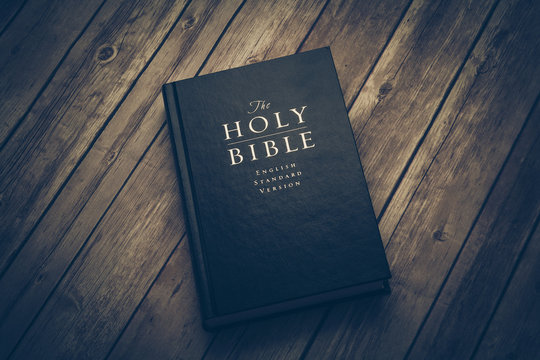 Holy Bible on wooden table