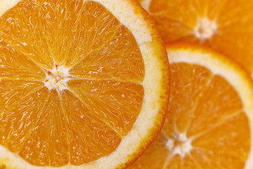 background made with a heap of sliced oranges