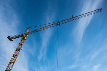 Construction crane against blue sky