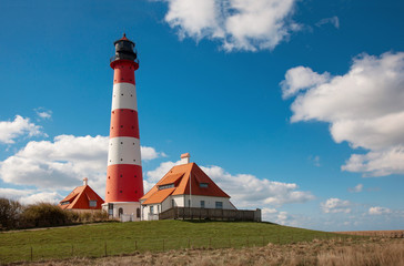 View of famous Westerhever lighthouse at North Sea coast, Germany