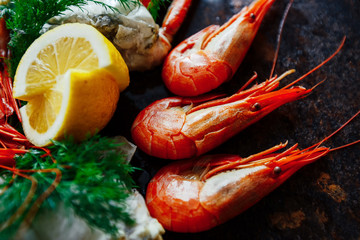 Delicious shrimp and crab meat with herbs and lemon close up