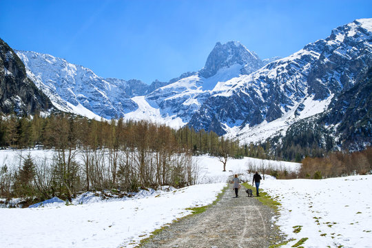 Idyllic scenic mountain landscape in the early springtime with hiking path. Austria, Tyrol, Karwendel Alpine Park, near Gramai