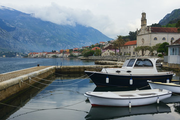 Fototapeta premium Evening landscape with moored boats in Kotor Bay, Montenegro