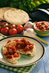Pita bread with vegetable spread- mediterranean kitchen style.