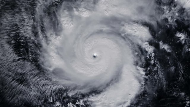 Hurricane storm tornado over the Earth from space, satellite view. Zoom