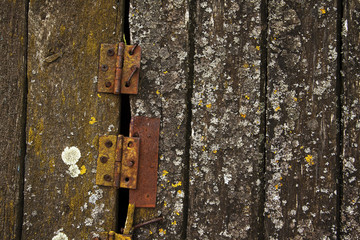 Old wood boards with iron hinges
