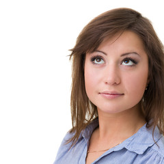 Closeup portrait of dreamy woman isolated on white