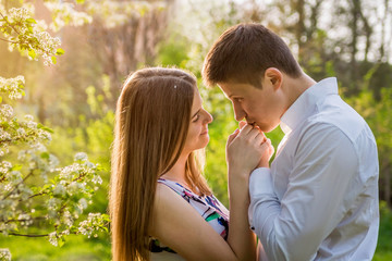 Fototapeta premium Portrait of young love couple in the garden