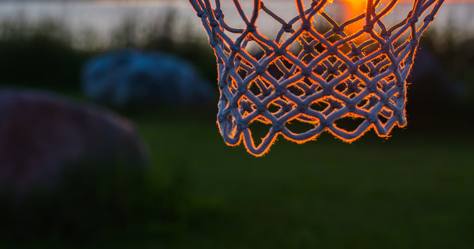 Basketball net in sunset light