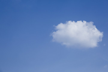 One cloud on blue sky background