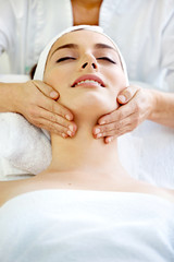 Fototapeta na wymiar Spa salon: Beautiful Young Woman having Neck Massage.
