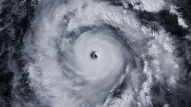Hurricane storm tornado over the Earth from space, satellite view.