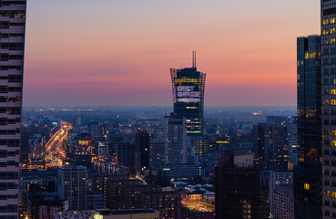 Fototapeta na wymiar Modern skyscraper in Warsaw after sunset, Poland