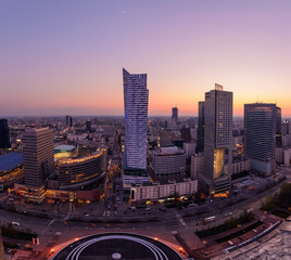 Panorama of Warsaw city with modern skyscraper during sunset