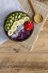 Acai bowl with napkin and spoon