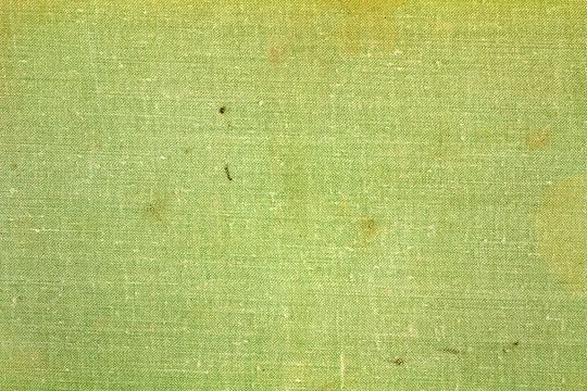 Green textile texture with dirty spots. Abstract background
