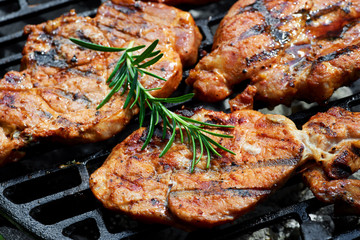 Meat during grilling. Chuck steak with herbs and spices