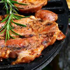 Meat during grilling. Chuck steak with herbs and spices