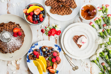 Table set for Breakfast with Homemade Chocolate Waffles and Berries
