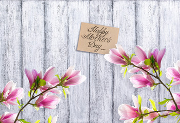 Magnolia flowers with paper greeting card for Mothers day