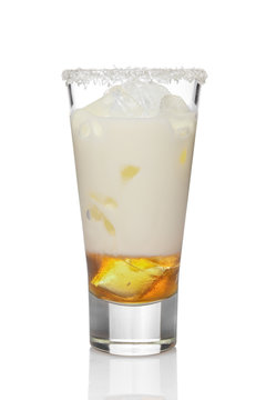 Coconut cream and rum cocktail in highball glass isolated on white. Pina colada drink.