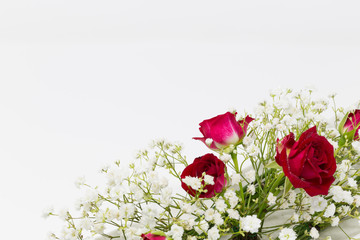 Baby's-breath flowers, red roses and horse tail flower arrangement isolated white background.