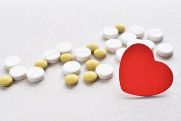 colored tablets with red heart