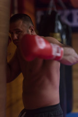 kick boxer training on a punching bag