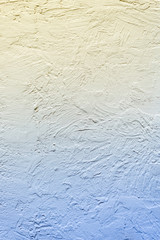 Background of a yellow-blue wall. Gradient of color. Vertical frame
