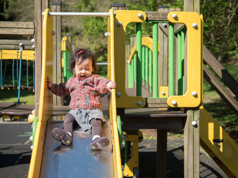 baby girl playing in the playground