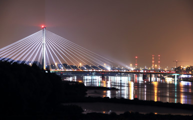 Warsaw city bridge at night.