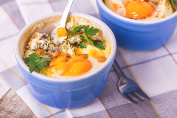 Eggs en Cocotte baked with spinach, parsley and cream.