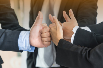 Group of business people meeting with thumb up gesture.Teamwork concept