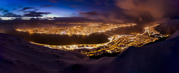 Panoramic view of awinterstorm approaching Tromso, Norway