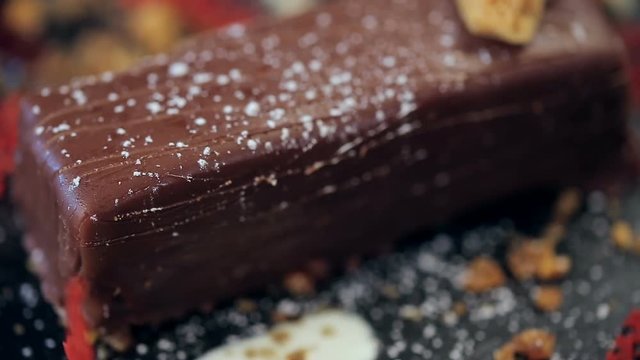 closeup refocusing panoramic shot on the parts of chocolate dessert in a restaurant.