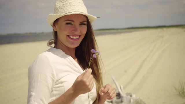 Happy girl having fun on beach. Young woman playing on sea shore, running, jumping. Vacation happiness and craziness concept 4K ProRes HQ codec