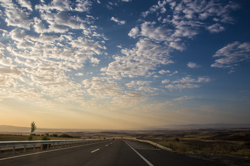 Fototapeta premium On the road at sunset