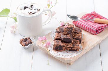 nama chocolate on wood plate white wood background.