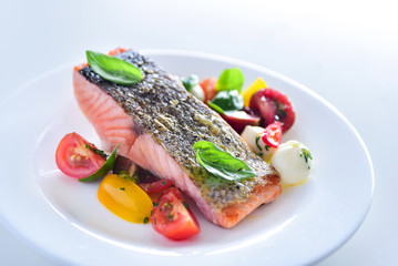 Salmon steak and salad