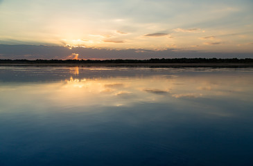 Fototapeta na wymiar sunset on the lake as a backdrop