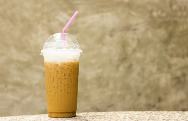 Ice coffee on table and stone background