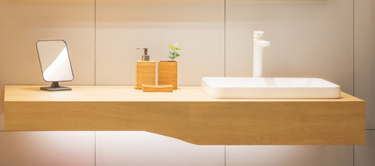 Fototapeta na wymiar Modern wooden wash basin sink counter of bathroom interior