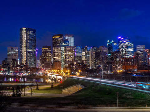 Calgary skyline at night along the Bow River.