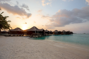 Over Water Bungalows at Sunset Sunrise in Maldives