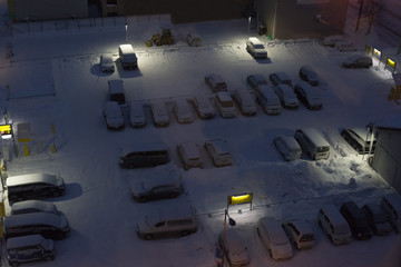 Parking lot covered with snow at night © oppdowngalon