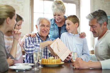 Family celebrating grandfather birthday together