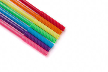 colored markers on the white background