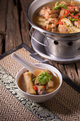 Chicken and herb soup in pot